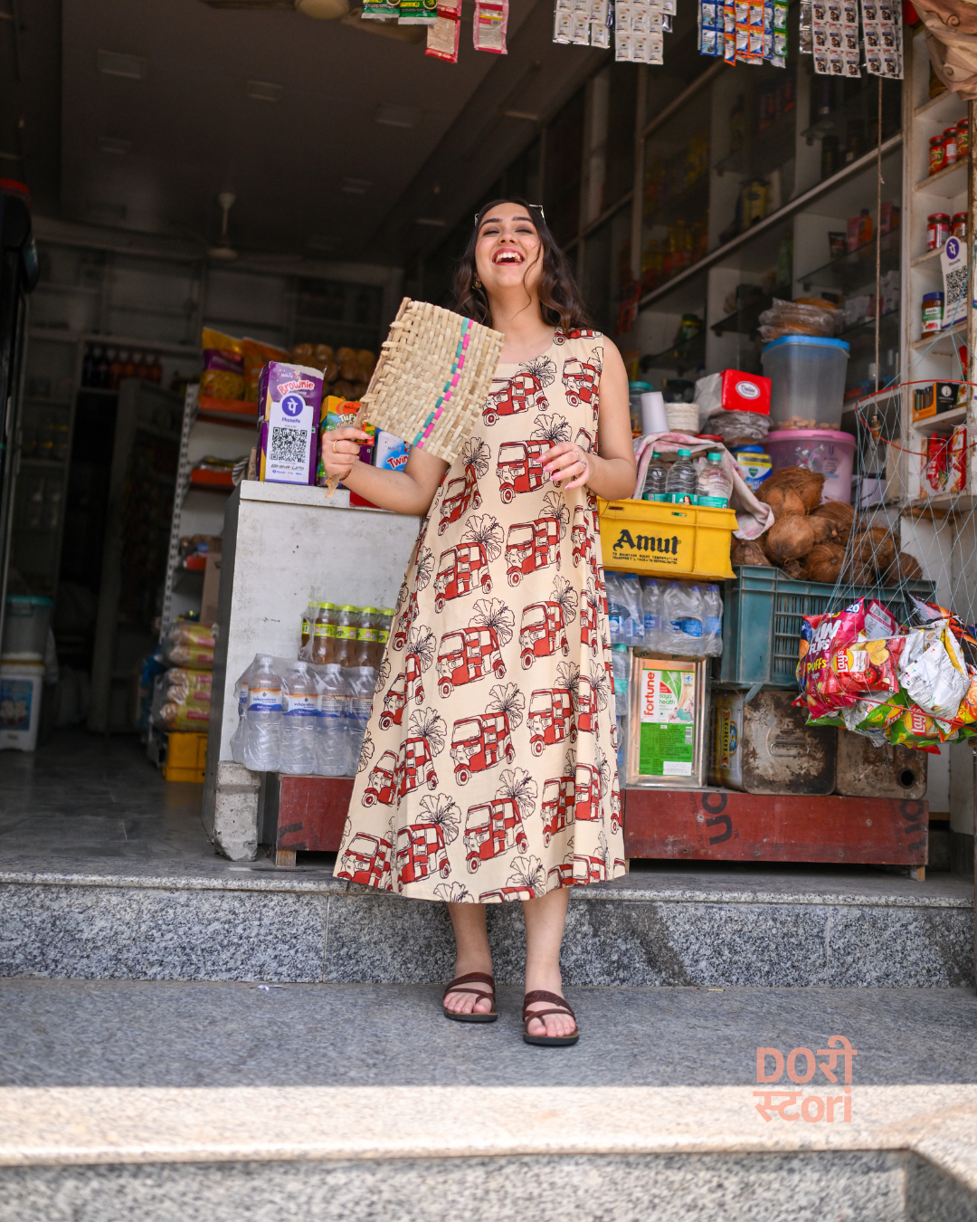 Woman wearing beige hand block printed cut-sleeve dress, hibiscus motif, natural dyed Cotton 60, styled for Indian summer and monsoon wear — Hawakhori dress by Dorii Stori 